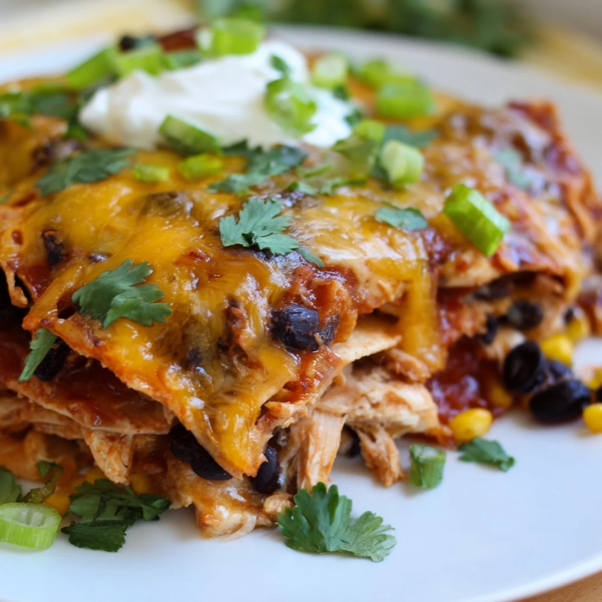 Golden melted cheese blankets this Chicken Enchilada Casserole with bubbling, savory perfection.