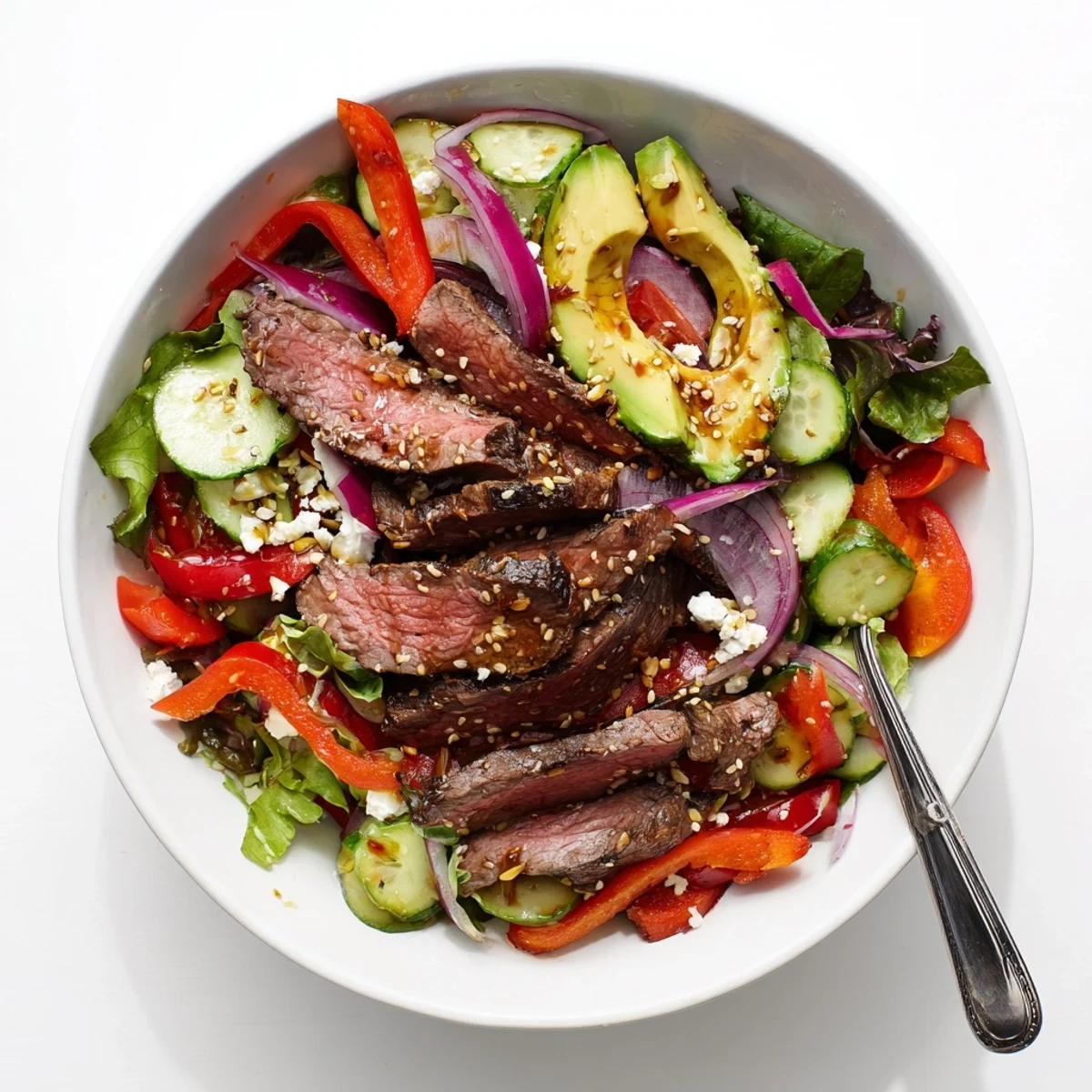 This hearty Beef Salad Bowl with Dressing features colorful vegetables and a zesty homemade vinaigrette, perfect for a healthy lunch.  