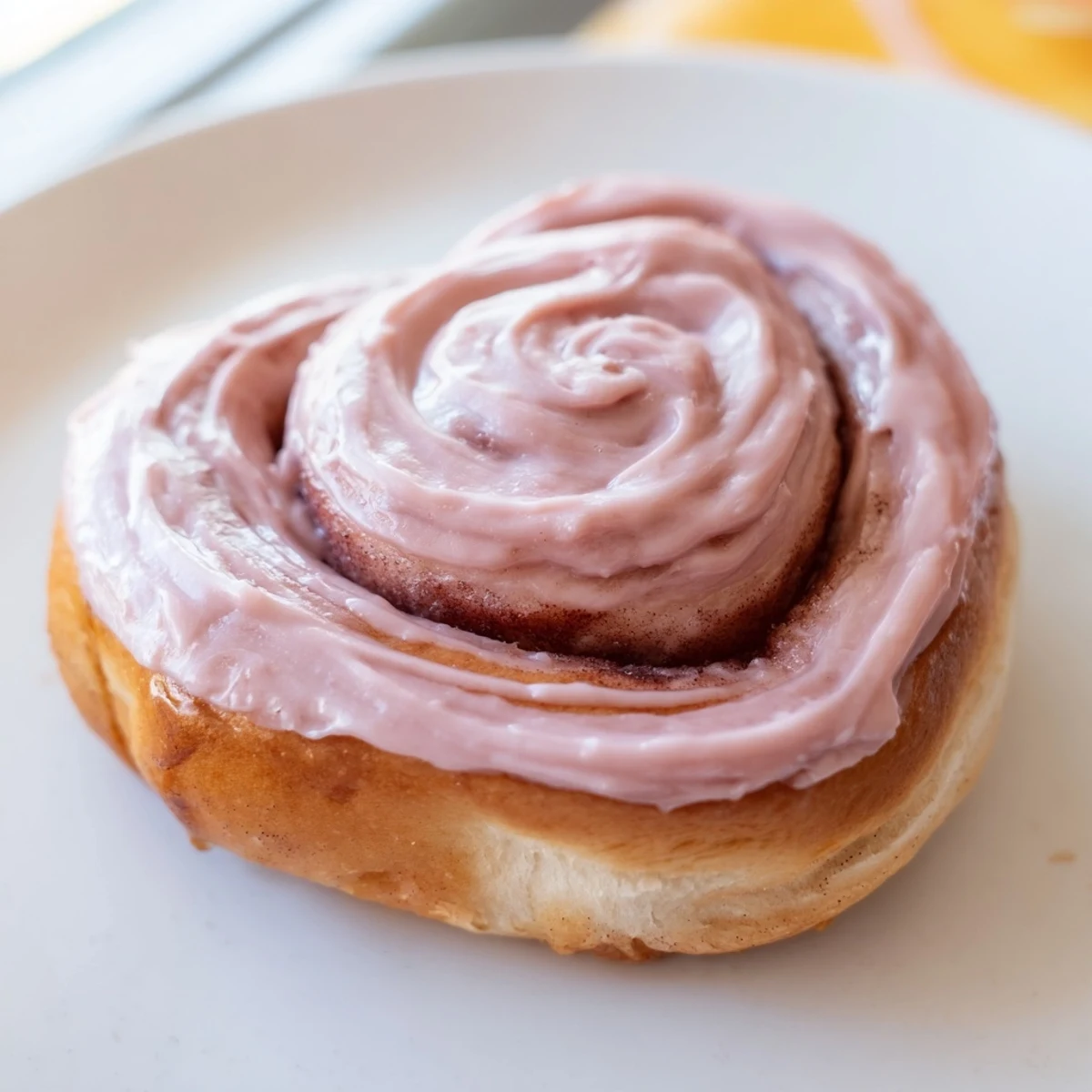 Warm Sweetheart Cinnamon Rolls with Pink Icing, served fresh from the oven with soft, fluffy swirls.
