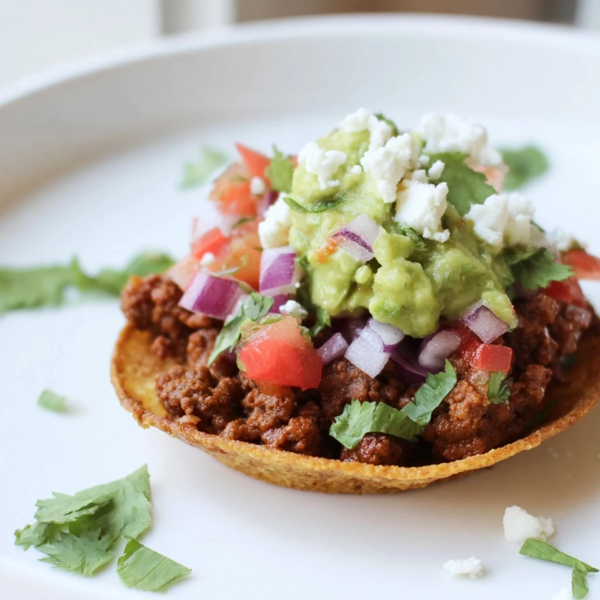 Close-up of mini tacos with salsa and guacamole, ready for a party appetizer platter.  