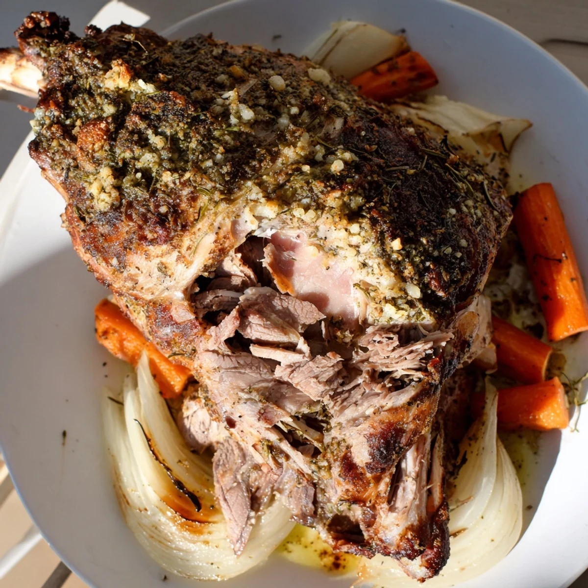 Tender slow-roasted lamb shoulder with herbs releasing fragrant steam beside fresh rosemary and sliced lemons.