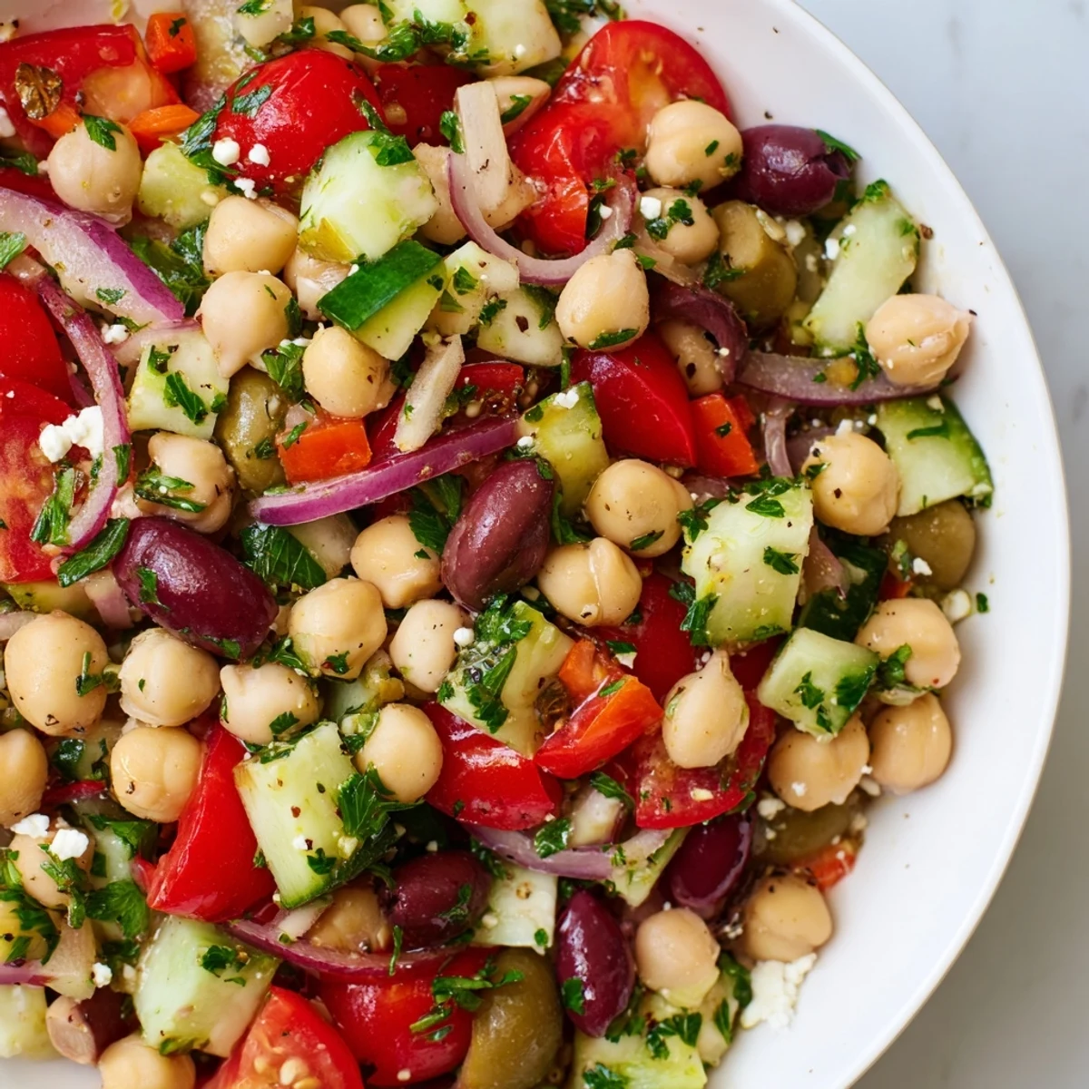 Hearty Mediterranean Dense Bean Salad served in a rustic bowl with fresh herbs and Kalamata olives.