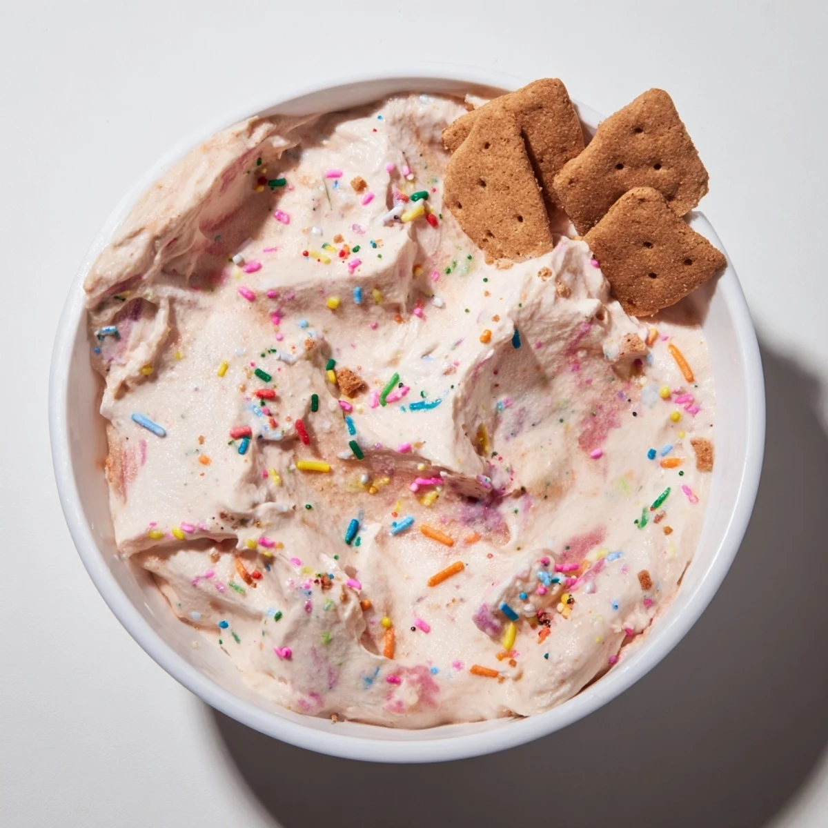 Swirled high protein Dunkaroo dessert dip with whipped cream cheese and Greek yogurt base