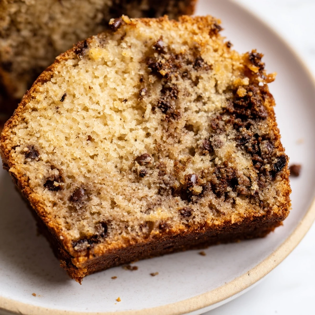Warm banana cake fresh from the oven with a crackled golden brown top crust