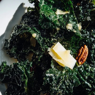 Winter Kale Salad with Apple and Sharp Cheddar features thin apple slices and crumbled sharp cheddar.
